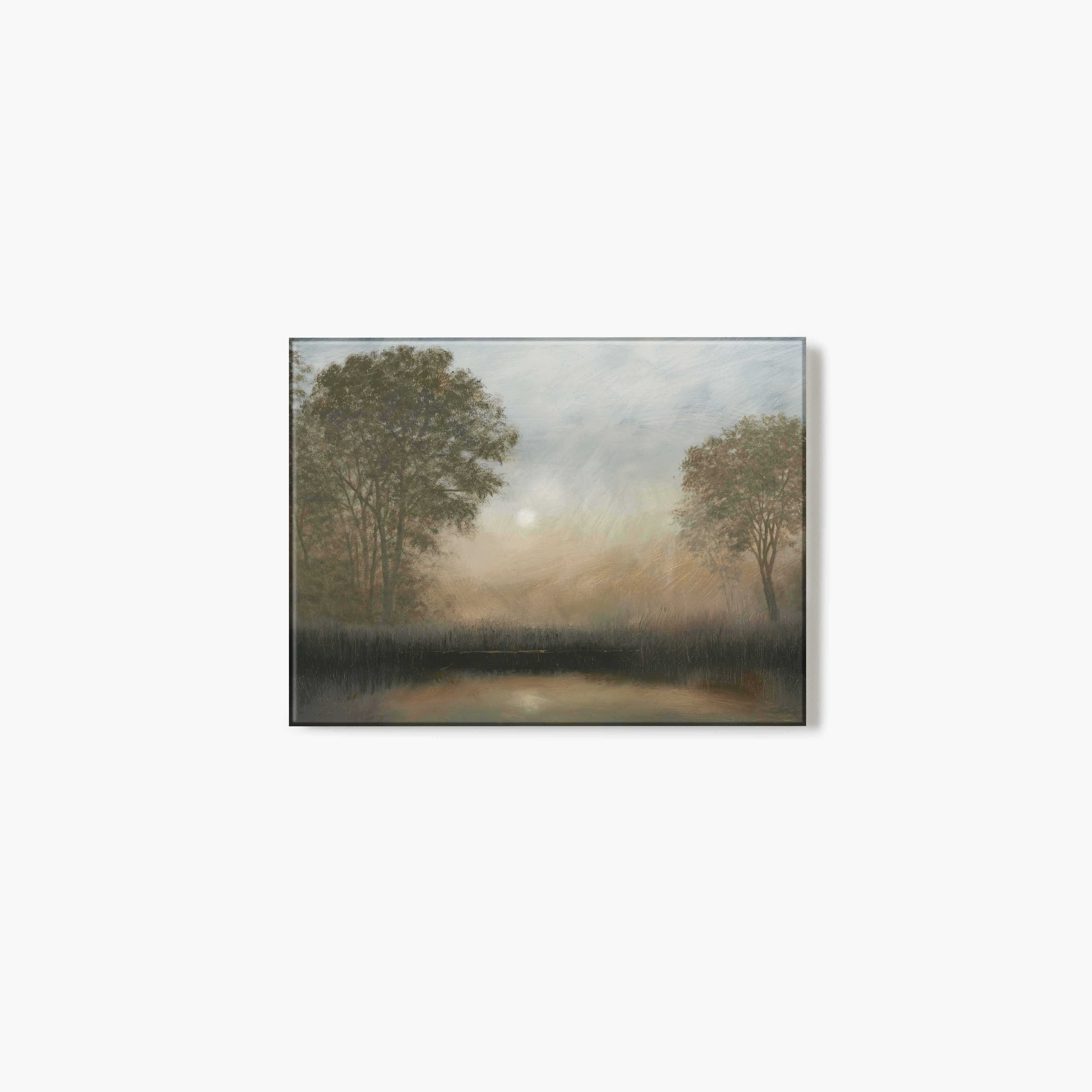 Glass print of artwork of a misty landscape with trees and a lake.